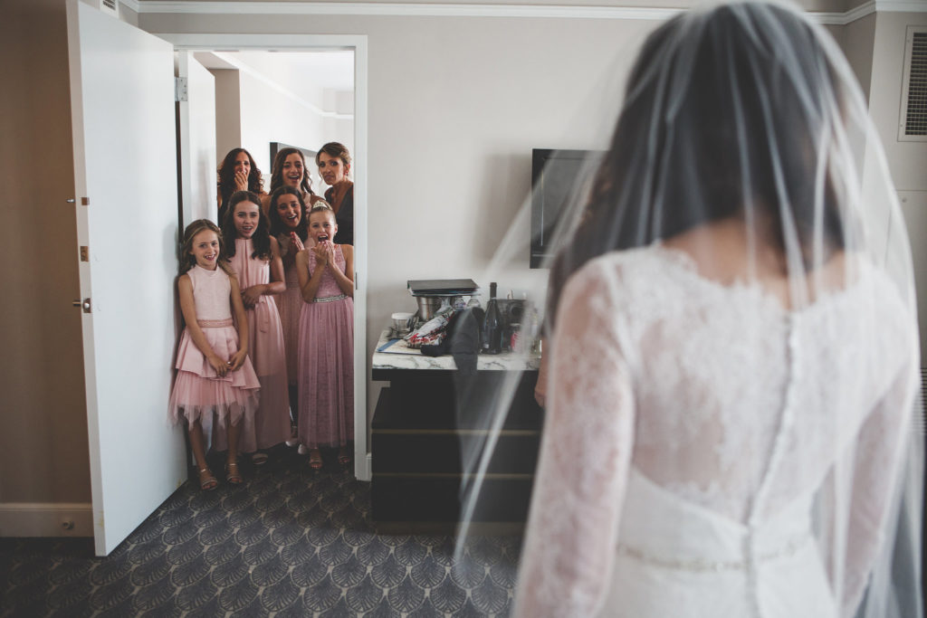 Seeing their aunt, the bride for the first time