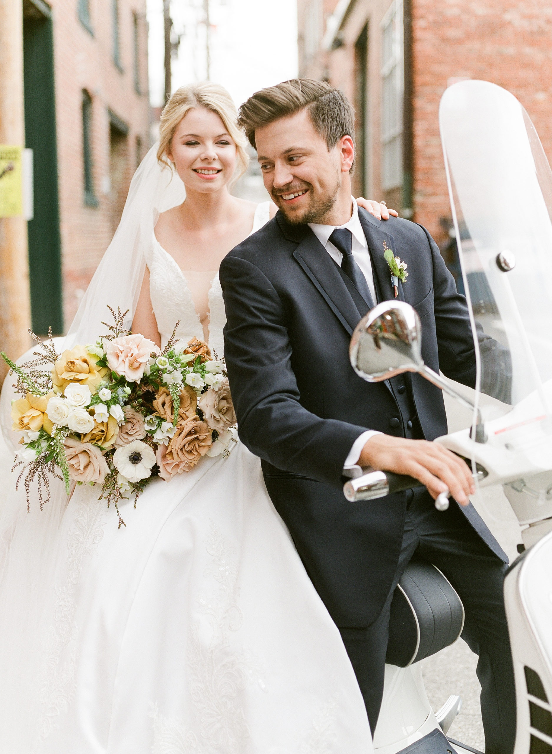 Bride-and-Groom-Vespa-Exit-|-The-Wedding-Experience-|-Planning-and-Stationery-by-Nellie-Sparkman-|-Floral-by-Blue-Bouquet-KC-Wedding-Florist